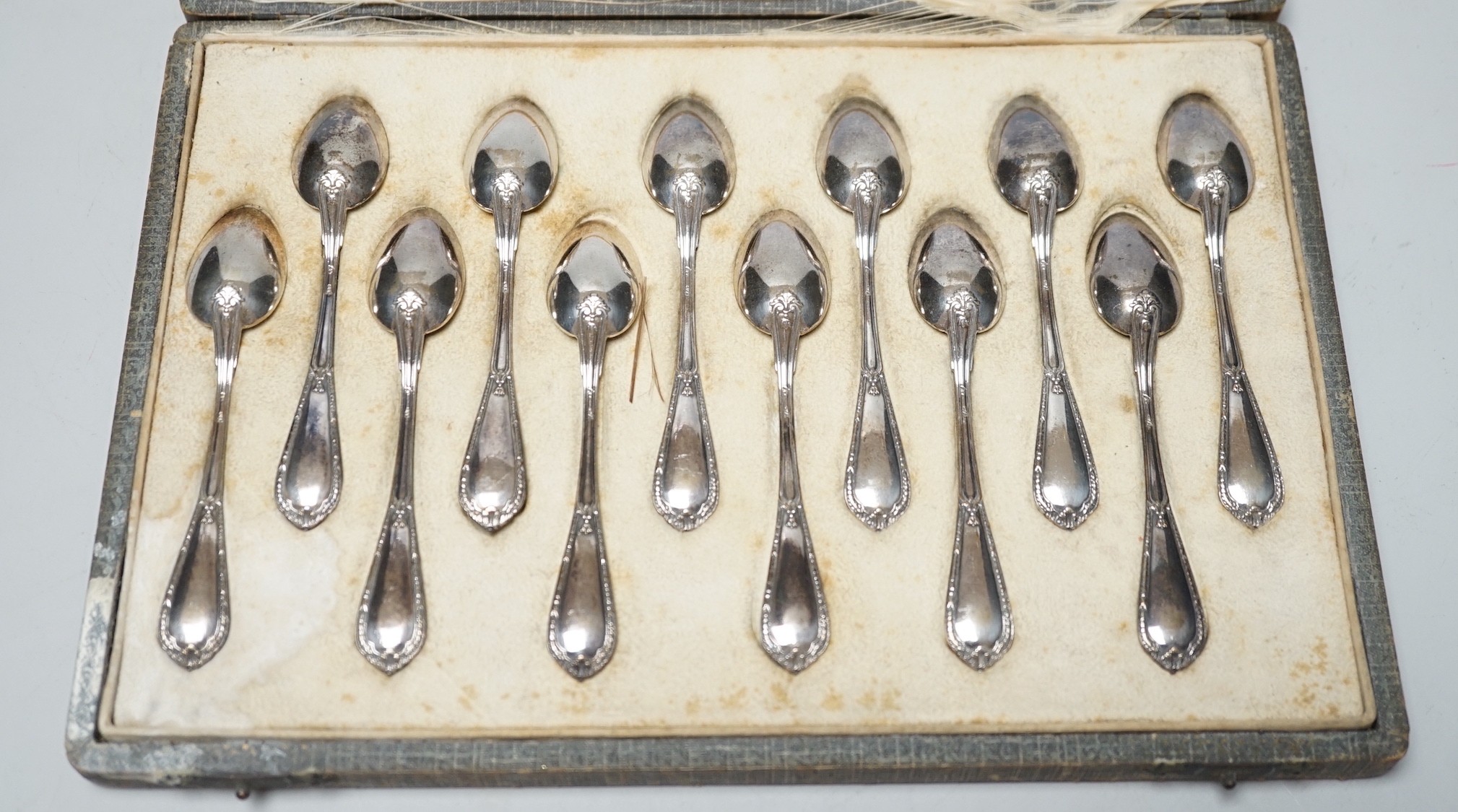 A cased set of twelve Belgian? 800 standard white metal coffee spoons, 10.2cm, 4.7oz.